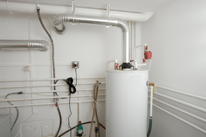 Boiler system with pipes and controls in a residential setting, relevant to plumbing and boiler repair services.