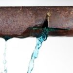 Burst pipe leaking water, highlighting potential plumbing emergency, relevant to preventive maintenance and emergency services by The Plumbing Dr.